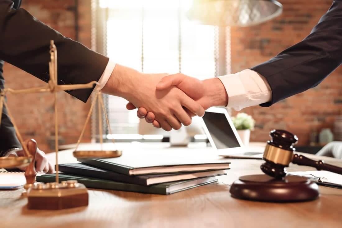 lawyer shaking-hands-with-client